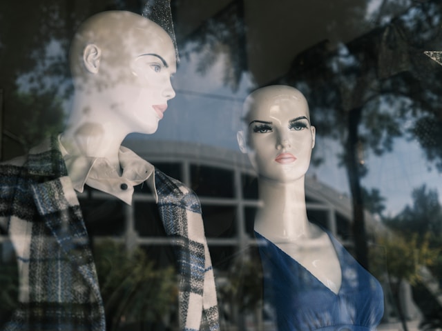 Two mannequins in a store's window